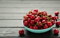 Fresh sweet cherries bowl on black background, top view Royalty Free Stock Photo