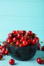 Fresh sweet cherries bowl on blue background, top view Royalty Free Stock Photo