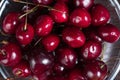 Fresh sweet cherries in bowl on dark background, top view Royalty Free Stock Photo