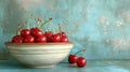 Fresh sweet cherries bowl with leaves in water drops on blue stone background, top view Royalty Free Stock Photo