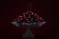 Fresh sweet cherries in a glass vase low key photo Royalty Free Stock Photo