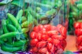 Fresh Sweet Cherry Tomatoes (Solanum lycopersicum L. var. cerasiforme ) and Organic Holland cucumbers are packed in plastic bags Royalty Free Stock Photo