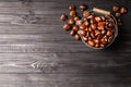 Fresh sweet edible chestnuts on black wooden  table, flat lay. Space for text Royalty Free Stock Photo