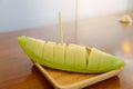 Fresh sweet green melon on wooden dish Royalty Free Stock Photo