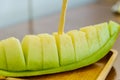 Fresh sweet green melon on wooden dish Royalty Free Stock Photo