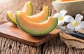 Fresh sweet orange melon on old brown wooden Royalty Free Stock Photo