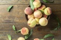 Fresh sweet peaches on the wooden table, selective focus. Royalty Free Stock Photo