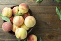 Fresh sweet peaches on the wooden table, selective focus. Royalty Free Stock Photo