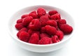 Fresh and sweet raspberries in a white bowl, isolated on white background Royalty Free Stock Photo