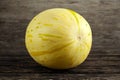 Fresh Sweet Snowball Melon on the wooden table. Royalty Free Stock Photo