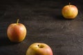 Fresh sweet three apples on dark black textured background