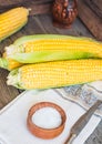 Fresh sweet yellow corn on wooden table, selective focus, closeu Royalty Free Stock Photo