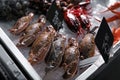 Swimming crabs and other seafood on ice in supermarket