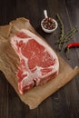 Fresh T-bone steack on wooden plate Royalty Free Stock Photo