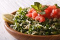 Fresh Tabbouleh salad macro in a wooden bowl. horizontal Royalty Free Stock Photo