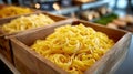 Fresh tagliatelle in wooden boxes at a market. Royalty Free Stock Photo