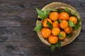 Fresh tangerine oranges on a wooden table. Peeled mandarin. Halves, slices and whole clementines closeup. Royalty Free Stock Photo