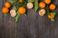 Fresh tangerine oranges on a wooden table. Peeled mandarin. Halves, slices and whole clementines closeup. Royalty Free Stock Photo