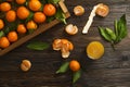 Fresh tangerine oranges on a wooden table. Peeled mandarin. Halves, slices and whole clementines closeup.
