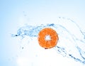 Fresh tangerine underwater on white background
