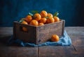 Fresh tangerines in wooden box on rustic table