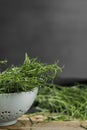 Fresh tarragon sprigs on wooden table, closeup. Space for text Royalty Free Stock Photo