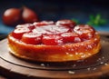 Fresh tarte tatin, upside down apple tart on wooden board tray or cut board, traditional french apple pie with caramelized apples