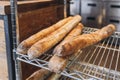 Fresh tasty Baguettes on bakery shelves. Concept of french delicious food. Delicious loaves of bread in baker shop. Food Royalty Free Stock Photo