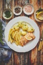 Fresh and tasty baked salmon served with young boiled potatoes and yellow bean. Royalty Free Stock Photo