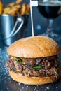 Fresh Tasty Big Chicken Burger with Cheese, Sauce and Fries on Dark Stone Background, Beer on the Background Royalty Free Stock Photo