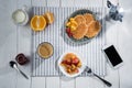 Fresh tasty breakfast with waffles and smartphone with blank screen on table Royalty Free Stock Photo