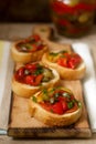 Fresh and tasty bruschetta with pickled bell pepper, capers and parsley.