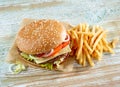 Fresh tasty burger and french fries Royalty Free Stock Photo