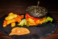 Fresh tasty burger and french fries on wooden table Royalty Free Stock Photo