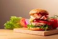 Fresh tasty burger on a wooden cutting board Royalty Free Stock Photo