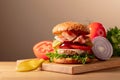 Fresh tasty burger on a wooden cutting board Royalty Free Stock Photo