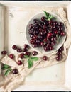 Fresh and tasty cherries, cherry from the market, decorated in a vintage baking tray,