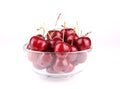 Fresh tasty cherries on glass bowl