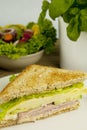 Fresh tasty club sandwich with cheese and ham on table