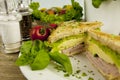 Fresh tasty club sandwich with cheese and ham on table