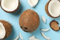 Fresh tasty coconut on blue background, top view Royalty Free Stock Photo