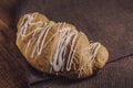 Fresh and tasty croissant with cream selective focus, delicious breakfast on brown napkin Royalty Free Stock Photo