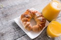 Fresh tasty croissants and orange juice Royalty Free Stock Photo