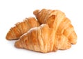 Fresh tasty croissants on white background