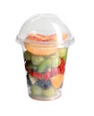 Fresh tasty fruit salad in plastic cup on background Royalty Free Stock Photo