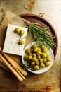 Fresh tasty greek green olives with cheese feta or goat cheese.