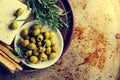 Fresh tasty greek green olives with cheese feta or goat cheese.