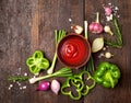 Fresh tasty ingredients for healthy cooking or salad with red sauce on a rustic background, top view, banner. Royalty Free Stock Photo