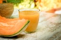 Fresh, tasty and juicy melon - cantaloupe and melon juice smoothie on table Royalty Free Stock Photo