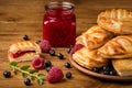 Fresh tasty pastries with raspberry jam